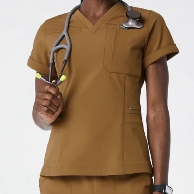Healthcare worker wearing tailored brown scrubs with a stethoscope