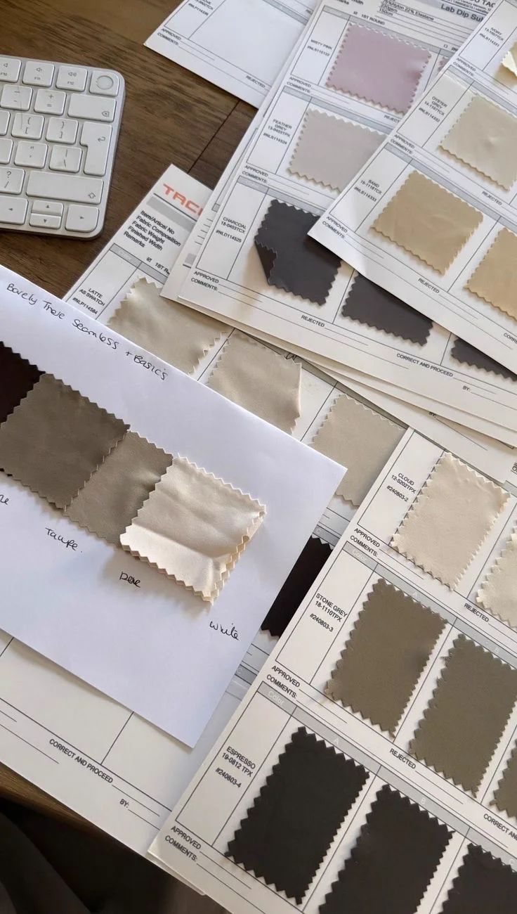 Lab-dip fabric swatches laid out on approval sheets